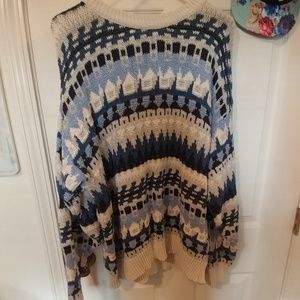 Long heavy knitted sweater.